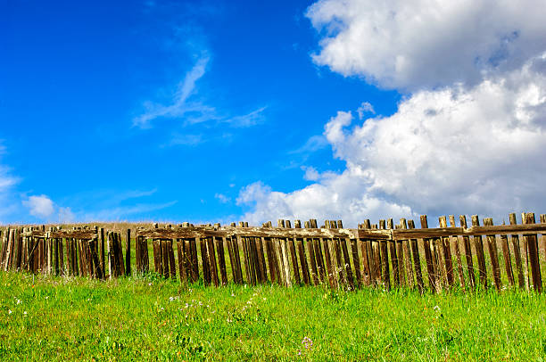 istock Rustic Wood Fence Against Cloudy Blue Sky 544141702