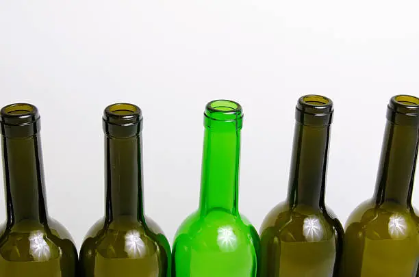 Empty bottles of wine on a light background.