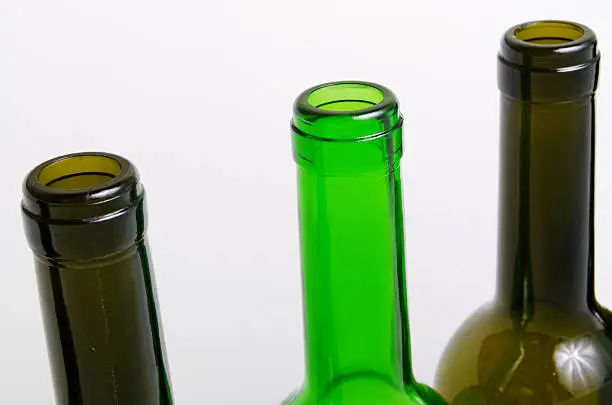 Empty bottles of wine on a light background.