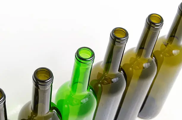 Empty bottles of wine on a light background.