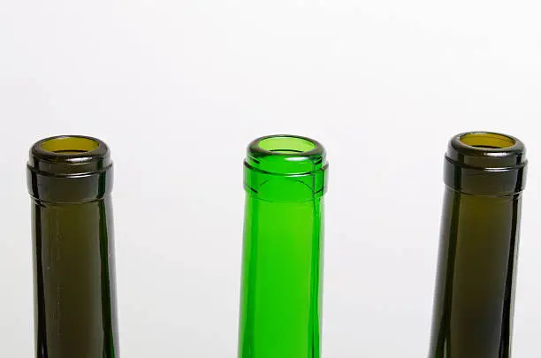 Empty bottles of wine on a light background.