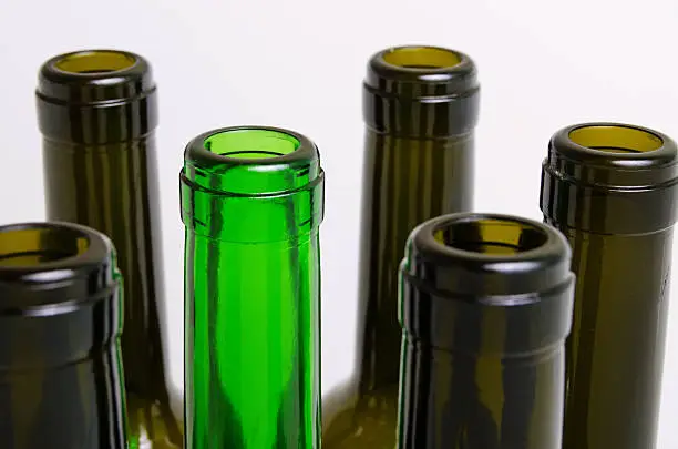 Empty bottles of wine on a light background.