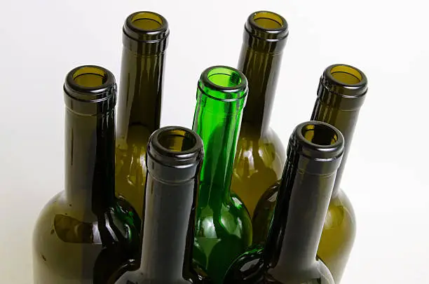 Empty bottles of wine on a light background.