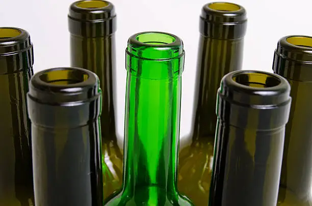 Empty bottles of wine on a light background.