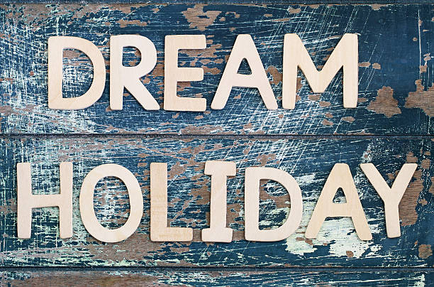 istock Dream holiday written with wooden letter on rustic surface 544315424