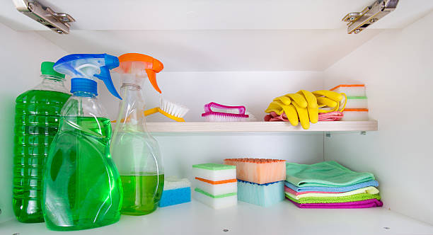 Cleaning supplies in pantry Cleaning supplies and tools arranged on shelves in pantry cleaning cupboard stock pictures, royalty-free photos & images