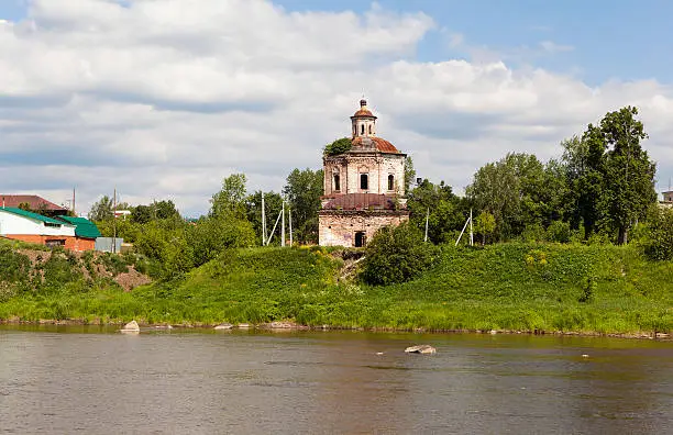 Verkhoturye, Russia - June 18, 2016: Stone building with a tower and dome that is in a dilapidated condition. Located on the banks of the river. Intercession (Staro Intercession) Church. Laid September 19, 1744 was built on the factory owners means MM Pohodyashina. The architect is unknown. Located in Verkhoturye, Sverdlovsk region, on the left bank of the River Tours, Str. Senyanskogo 13