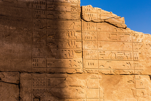 The ruins of ancient architecture in the temple of Karnak with carvings of ancient calendar, Luxor, Egypt