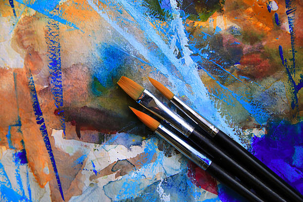 Closeup of brushes and palette.