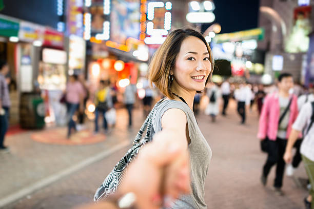 happiness japanese woman in tokyo walking together happiness japanese woman in tokyo walking together japanese girlfriends stock pictures, royalty-free photos & images