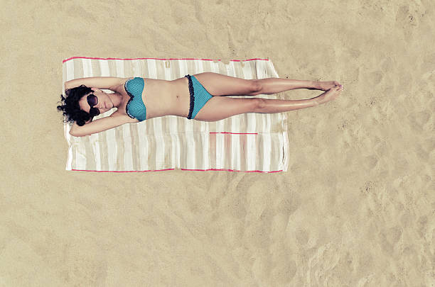 istock Bermuda Sunbathing girl 544319266