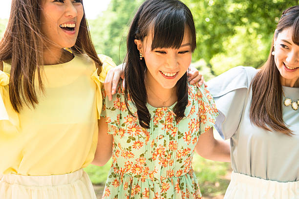 istock japanese friends walking togetherness 544320586