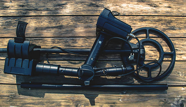 istock Metal detector on wood background 544320738