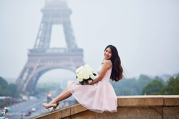 istock Parisian woman in front of the Eiffel tower 544321800