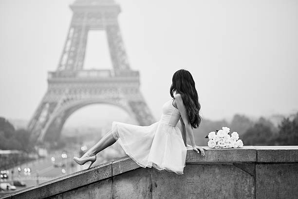 istock Parisian woman in front of the Eiffel tower 544321902