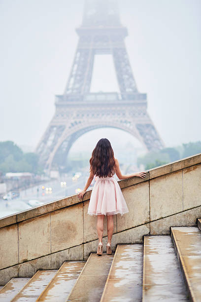 istock Parisian woman in front of the Eiffel tower 544321982