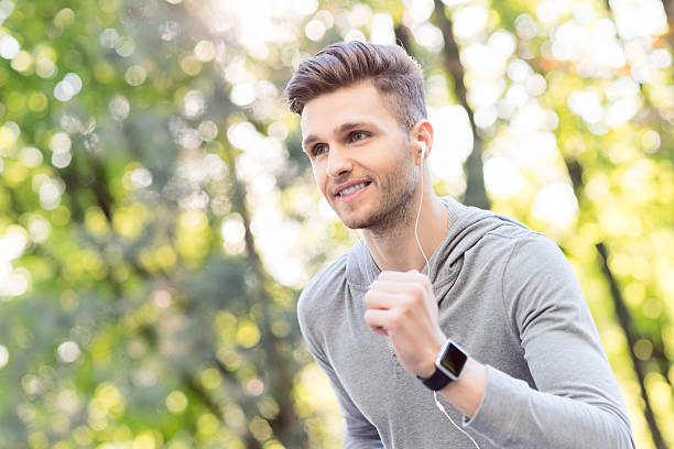 istock Cheerful young runner jogging outdoors 544323842