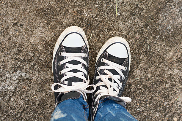 istock Black Sneakers shoes on road concrete 544325198