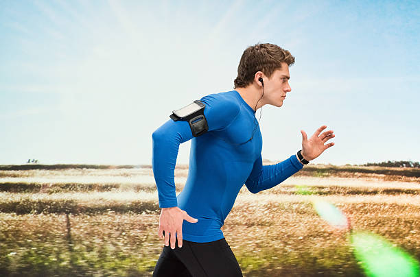istock Male runner running outdoors 544325392