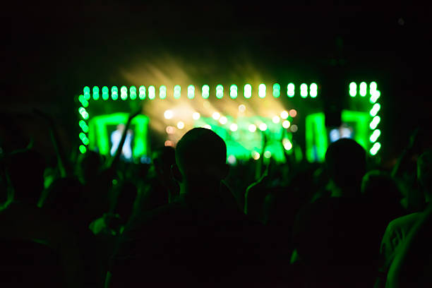 istock Silhouettes of people and musicians 544325890