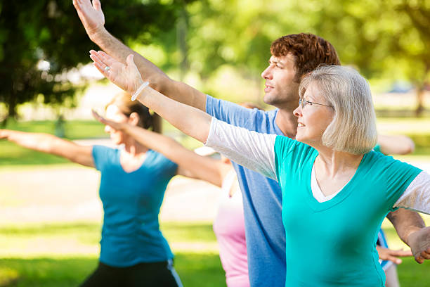istock Senior woman holds yoga pose 544325914
