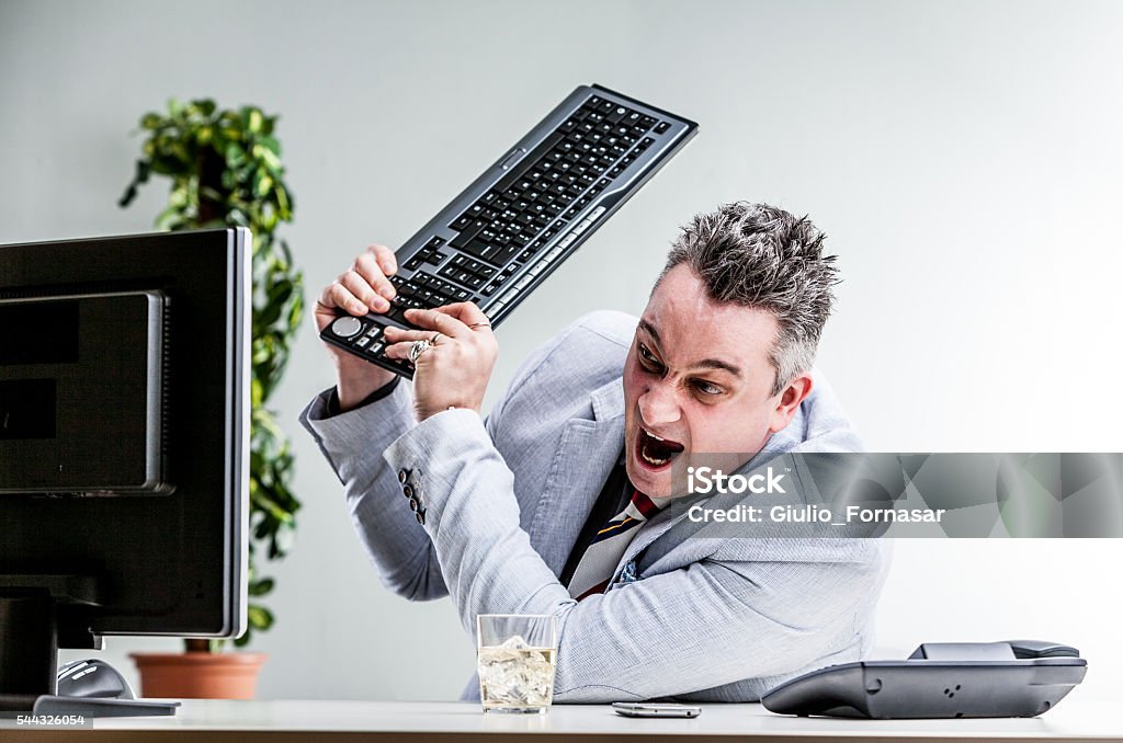 The Office Computer Rage Office Worker Destroying His Computer Stock Photo - Download Image Now ...