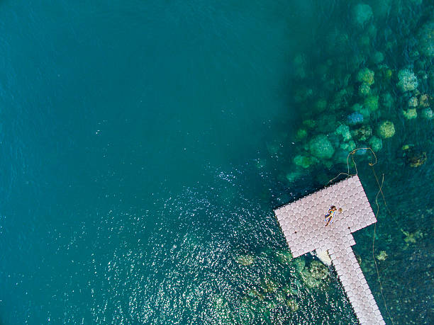 istock Woman on pontoon bridge aerial view 544326430