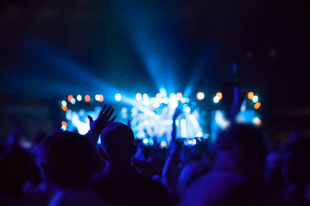 istock Silhouettes of people and musicians 544326842