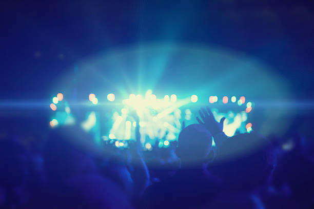 istock Silhouettes of people and musicians 544326882