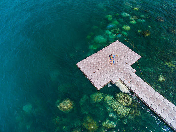 istock Woman on pontoon bridge aerial view 544327168