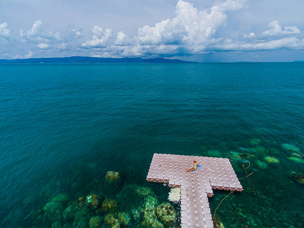 istock Woman on pontoon bridge aerial view 544327294