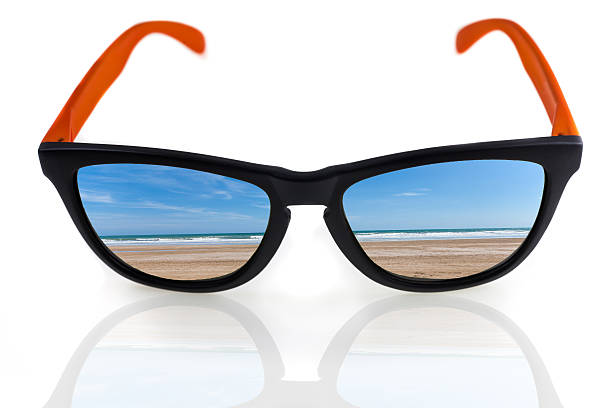 istock Beach and waves reflected in sunglasses on a white background. 544330760
