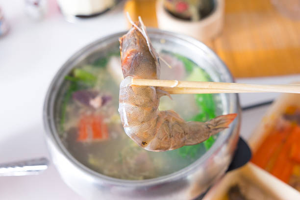 use chopstick boiled shrimp over shabu hot pot