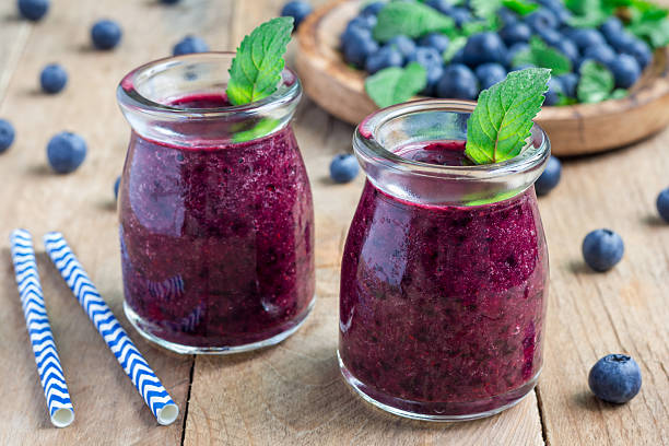 fresh smoothie with blueberry, plum, mint and basil - plum fruit organic food and drink imagens e fotografias de stock