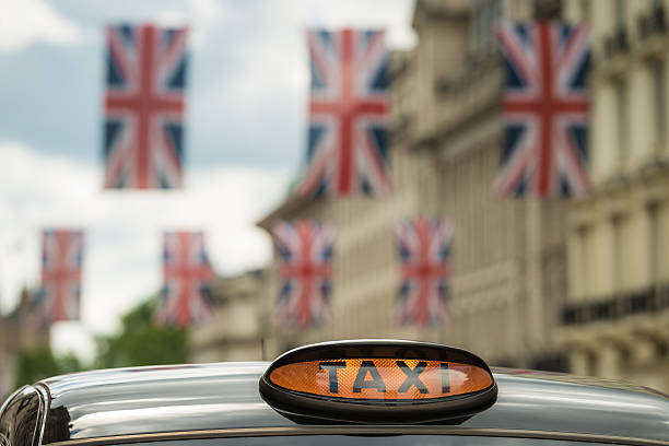 London taxi and British flags on Regent street.