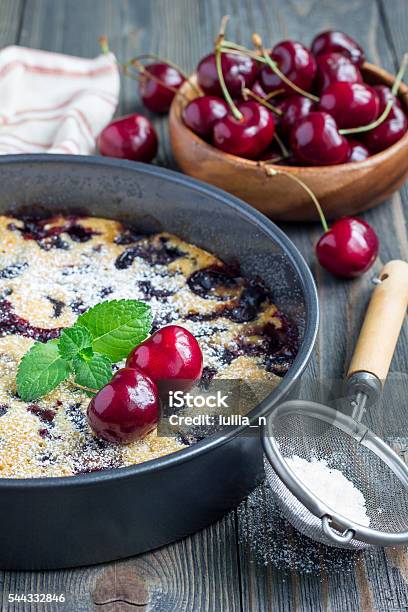 Clafoutis With Cherry In Baking Dish Vertical Stock Photo - Download Image Now - Backgrounds, Baked, Baked Pastry Item