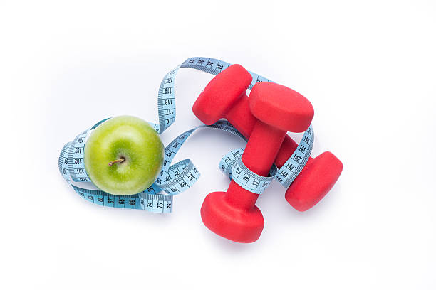 istock Apple, dumbbells and tape measure 544333542