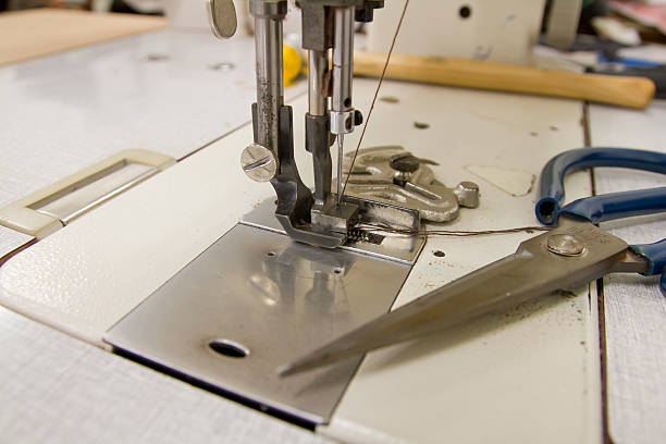 istock Closeup of sewing machine working part 544337686