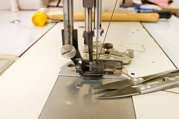 istock Closeup of sewing machine working part 544337758