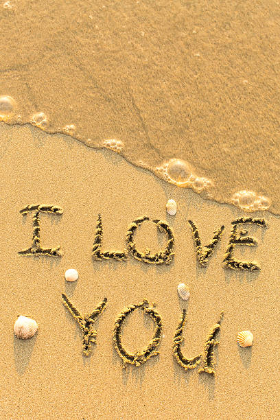 istock I Love You - text written on sandy beach 544337816