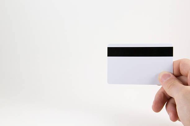 istock Hand with a credit card on a white background 544338422