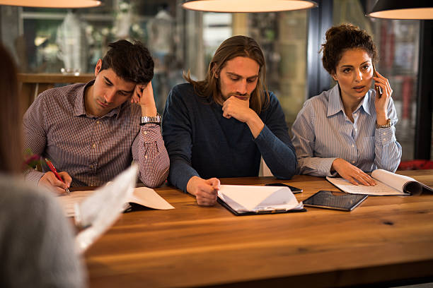 istock Multi-tasking group of business people in the office. 544338692