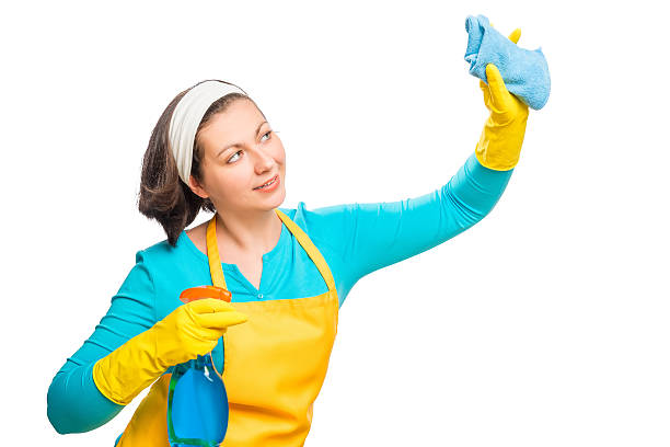 istock Young housewife cleans something on a white background 544341014
