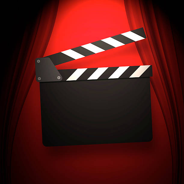 istock Movie clapperboard on a red 544343538