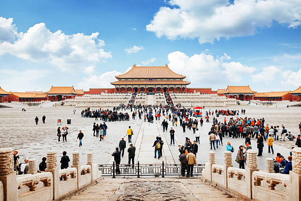 Entrance to Forbidden City in Beijing, China Entrance to the forbidden city in Beijing, China. Lot's of tourists meeting in front of the temple. forbidden city stock pictures, royalty-free photos & images