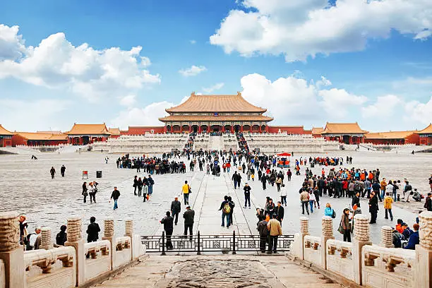 Entrance to the forbidden city in Beijing, China. Lot's of tourists meeting in front of the temple.