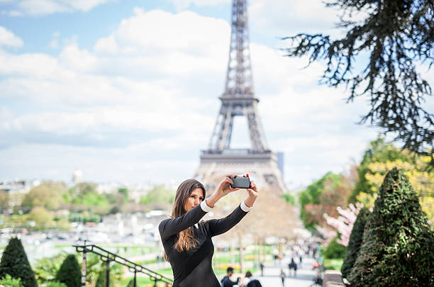 istock Attractive Woman Taking A Selfie At The Eiffel Tower 544346696