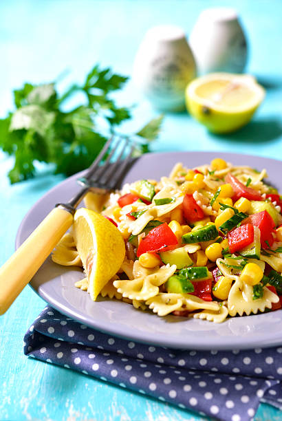 istock Pasta salad with tomato,bell pepper,cucumber and sweet corn. 544348132