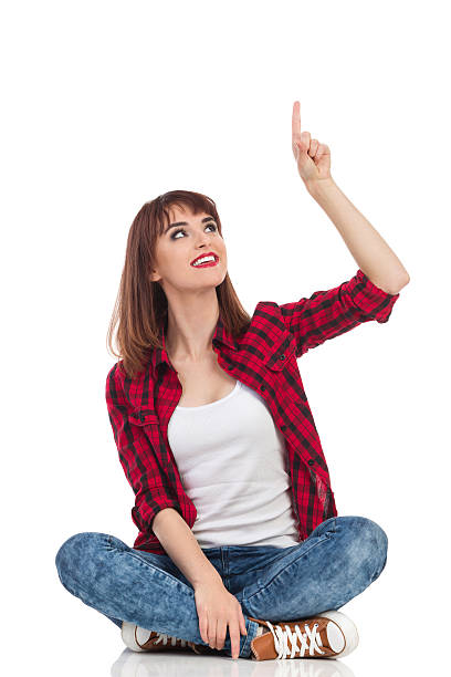 Sitting Casual Woman Pointing Above Head