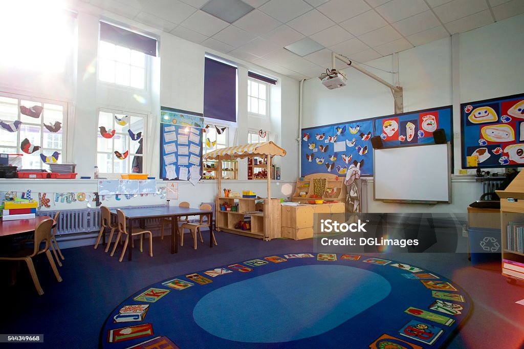 School Classroom Interior Landscape image of an empty, nursery classroom. there is a rug in the middle of the room. Classroom Stock Photo
